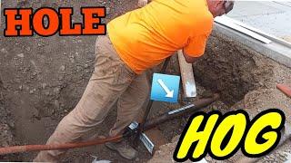 Using a HOLE HOG to BORE ACROSS CONCRETE #construction #excavation #holehog