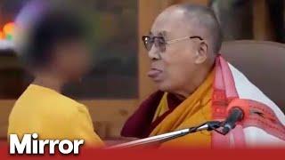 Dalai Lama asks little boy to 'suck my tongue'