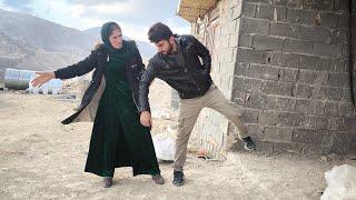 Jamila stops Farshad from entering the house.