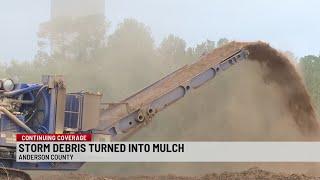 Crews break down debris into mulch