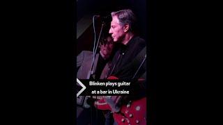 Blinken plays guitar at a bar in Ukraine