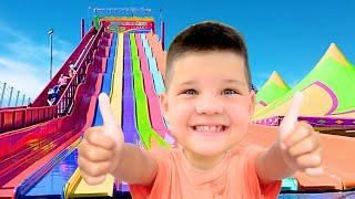 FIRST ROLLER COASTER RIDE at FUN FAIR! CALEB RIDES OUTDOOR AMUSEMENT PARK RIDES for KIDS with DAD!