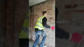 Young apprentice Fletch plastering with hotlime for the first time ever.