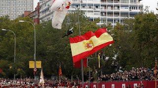 Parachutist left dangling during Spain's National Day parade