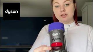 How do I empty and clean the bin on my Dyson V8?