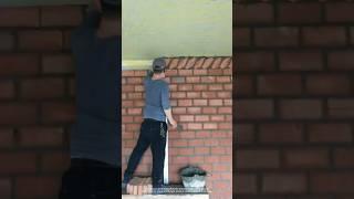 A mason builds interior walls of a house