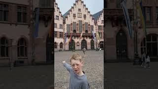 11 yr gives tour of Romerberg in Old Town Frankfurt Germany