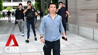 Kurt Tay heckled as he leaves the State Courts in Singapore