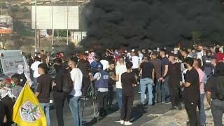 Palestinians protest near DCO checkpoint in Ramallah | AFP