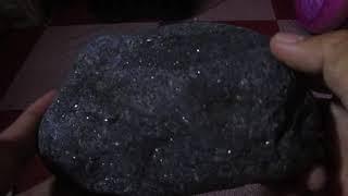 sparkling black rare stone discovered during digging....what type of rock is this?