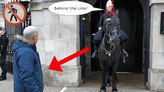 CLUELESS tourist cross the line and got told off by the King's Guard " BEHIND THE LINE"!