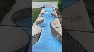 3D Chalk Art:  a river running through a canyon