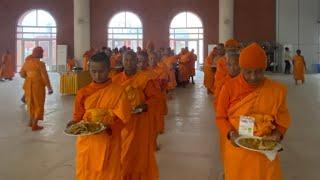 Receiving food in the Nepalese novice ordination project 2025