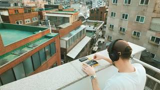 making music with the Roland P-6 on a rooftop in Seoul at sunset