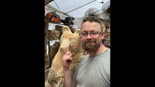 Working on a chainsaw carved bear . Carving the eyes
