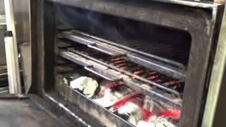 Cooking steak on the Josper at Blackwood's Bar & Grill at the Nira Caledonia