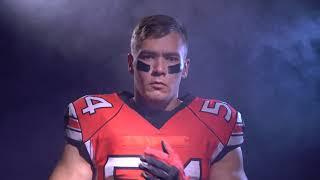 american football player warming up in smoke