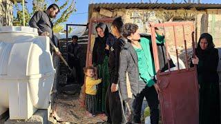 Operator Reza brings the door to Susan and her children's house in the heaviest rain