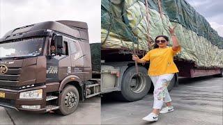 Beautiful Young Woman Professional Truck Driver Sitting And Driving Big Truck Cross Country