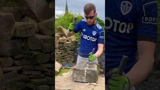 Splitting reclaimed stone into two pieces that can then be walled! ️