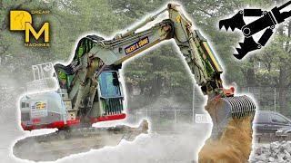 compact excavator TAKEUCHI TB2150R demolishing huge public swimming pool