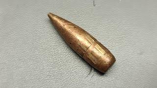 What does rifling do to a bullet?