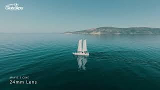 Mavic 3 Cine, Short Video with Normal and Tele Camera. Aerial Filming of Sailboat in Calm Sea.