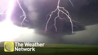 Close call when storm chaser's van is STRUCK by lightning