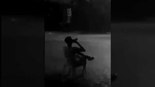 Guy sitting in rain