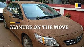 Indian woman covers her car in cow dung to avoid scorching heat