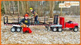 Hauling trees with kids ride on logging semi truck and cutting with chainsaw. Educational | Kid Crew