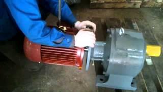 Helical gear motor reducer