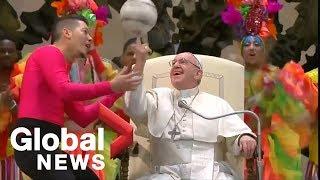 Pope Francis shows off ball spinning skills alongside circus performers