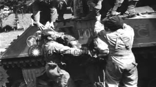 French tank crew removing body of dead soldier from tank and laying him on blanke...HD Stock Footage