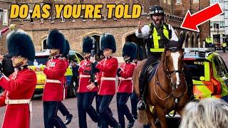 CAUGHT OFF GUARD: POLICEMAN BRINGS HIS HORSE OVER AND SHOUTS