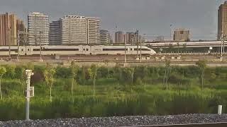 Leaving Xi'an North Station China on our 350kph high speed train alongside another High Speed Train