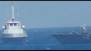 Watch as the US Navy fires warning shots toward an Iranian patrol boat