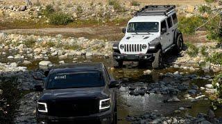 Nissan Titan and Jeep Rubicon off road  at  Bowman Lake