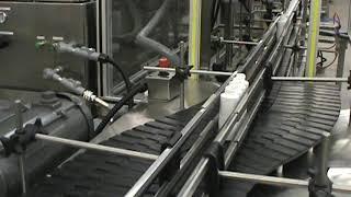 Oden inline automatic liquid filler with S-box conveyor transfer system