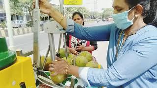 self employed women selling Chilled Coconut water using  advanced Cart- per unit 50 rupees