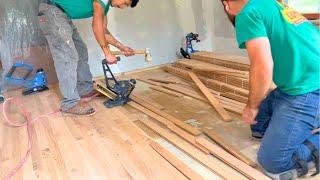 When in the construction process should you install hardwood floors?