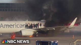 American Airlines plane catches fire at Denver International Airport