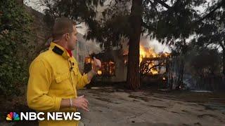 Fire alarms sound as flames engulf building during live NBC News report