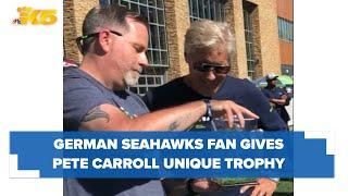 German Seahawks super fan presents Pete Carroll with unique trophy