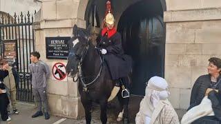 woman in a white burka and 2 other people ignor the white lines #britishkingsguard