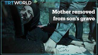 Israeli forces pull Palestinian mother away from her son’s grave