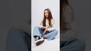 Minimalist studio portrait of a young model sitting gracefully  #StudioShoot #portraitphotography