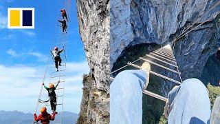 Daredevil cliff climbing experience at Chinese mountain thrills tourists