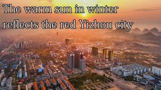 Aerial China:The warm sun in winter reflects the red Yizhou city