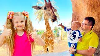 Diana and Roma feed the animals at the Emirates Park Zoo